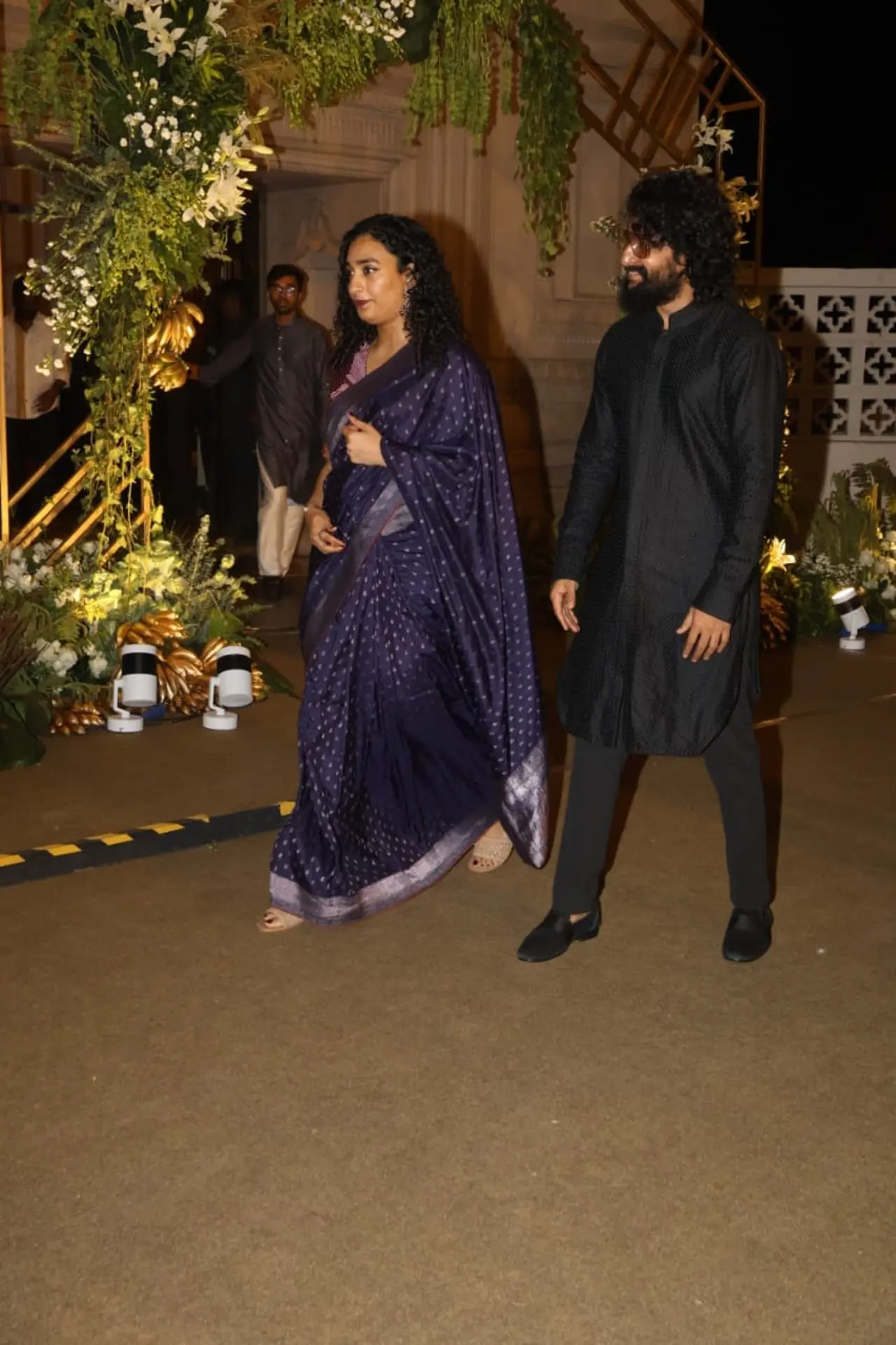 Nani arrived at the reception with wife Anjana Yelavarthy, making an elegant appearance together. While Nani looked dapper in a classic black kurta set, Anjana stunned in a rich purple saree.